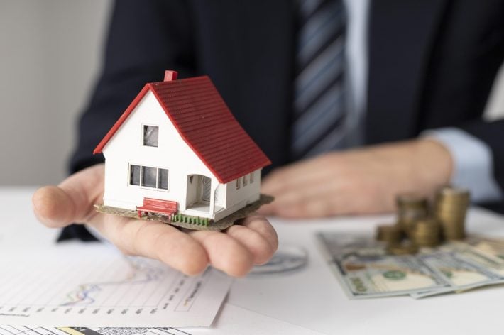 Oregon home with financial charts and growth arrows symbolizing long-term wealth building through smart mortgage strategies